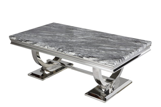 Arriana 1.5 m dining table with a gray veined stone top and polished metal loop legs