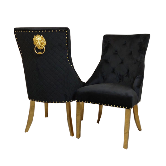 Pair of black velvet dining chairs with quilted backs, gold legs, and decorative gold back rings