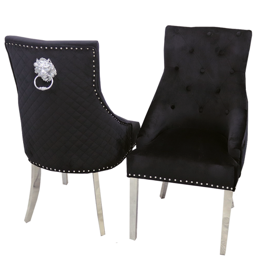 Pair of black velvet dining chairs with chrome legs, tufted backs, nailhead trim and ring pulls