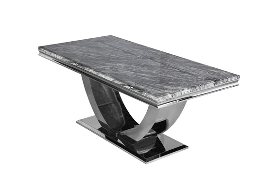 Arial dining table with a gray veined stone top and sculptural chrome pedestal base