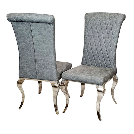 Set of two gray leather dining chairs with diamond cross-stitch backs and curved metal legs