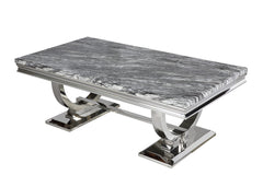 Arriana 1.5 m dining table with a gray veined stone top and polished metal loop legs