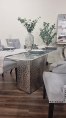 Louis Chrome dining table with a gray veined top and textured pedestal base
