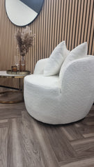 White teddy fabric accent chair with a rounded seat, curved arms, and two cushions