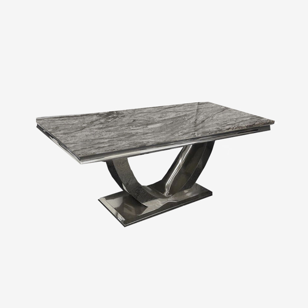 Arial dining table with gray veined stone top and polished sculptural pedestal base