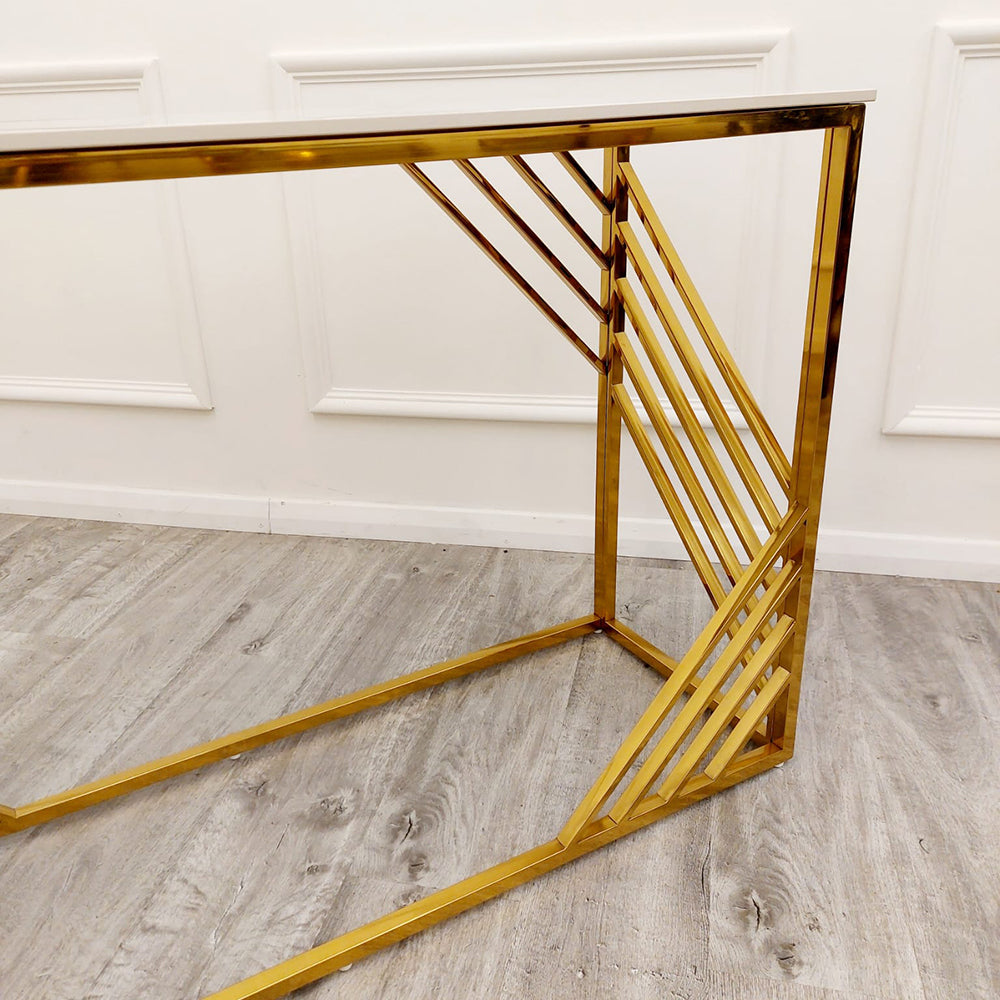 Gold metal console table frame with diagonal supports and a white top