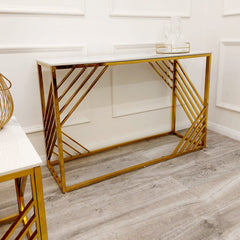 Console table with a white top and open geometric gold frame