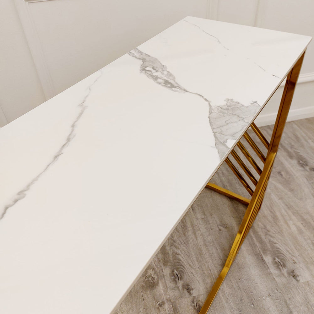 White console table top with gray veining and gold trim