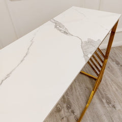 White console table top with gray veining and gold trim