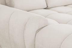 Azzuro sofa close-up showing textured cream upholstery and a rounded armrest
