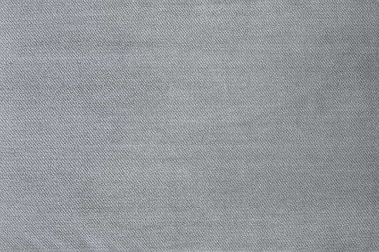 Azzuro footstool's close-up gray woven upholstery