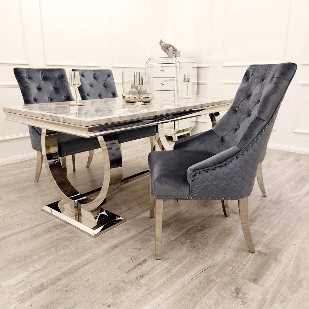 Velvet dining chair with tufted back, quilted sides, nailhead trim, and chrome legs