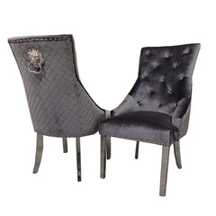 Pair of dark gray velvet dining chairs with tufted backs, quilted backs, and chrome legs