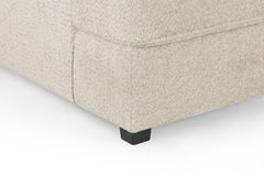 Carnaby sofa corner detail showing textured beige fabric and a black foot