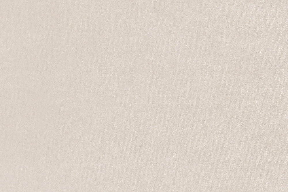 Close-up of the sofa's light beige upholstery fabric