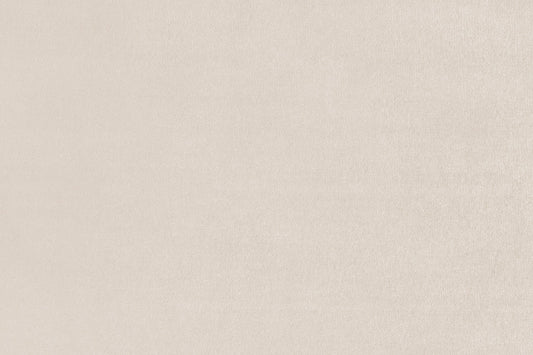 Close-up of the sofa's light beige upholstery fabric