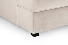 Close-up of the sofa's upholstered corner and black foot