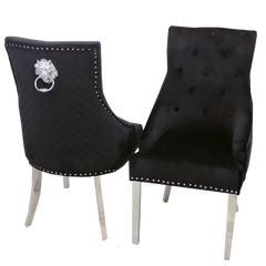 Pair of black velvet dining chairs with chrome legs, tufted backs, nailhead trim and ring pulls