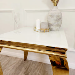 Close-up of the Louis Gold Lamp Table's white top and reflective gold frame