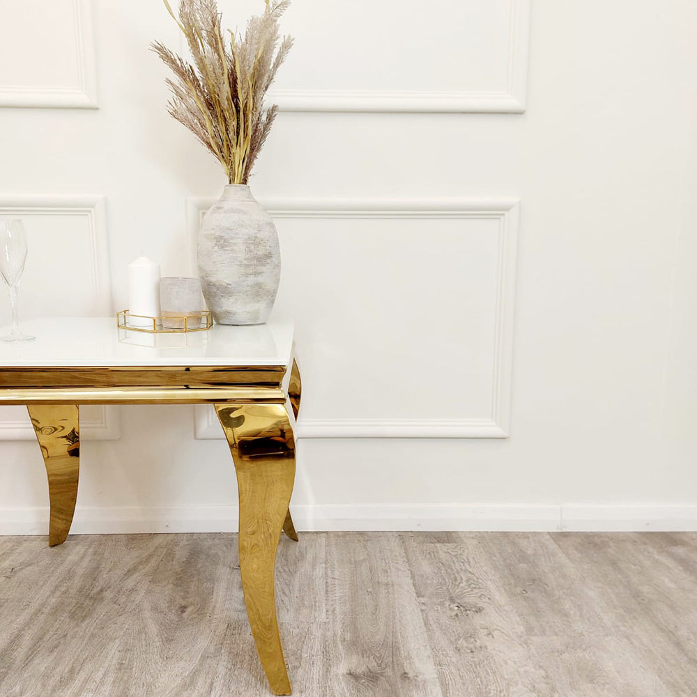 Louis Gold Lamp Table showing its white top and sculpted gold legs from the side