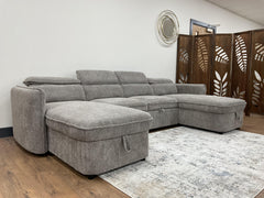 Gray U-shaped sofa bed shown from an angled side view