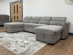 Gray sectional sofa bed with deep chaise seats, viewed from the opposite side