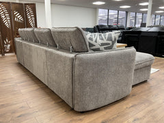 Back view of gray sofa bed with adjustable headrests