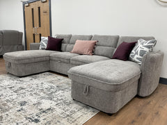 Capri U-shaped sofa bed in a corner configuration with chaise seats and pillows