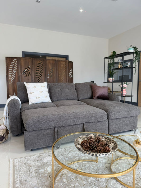 Gray fullback sofa bed with upright back cushions and extended seats