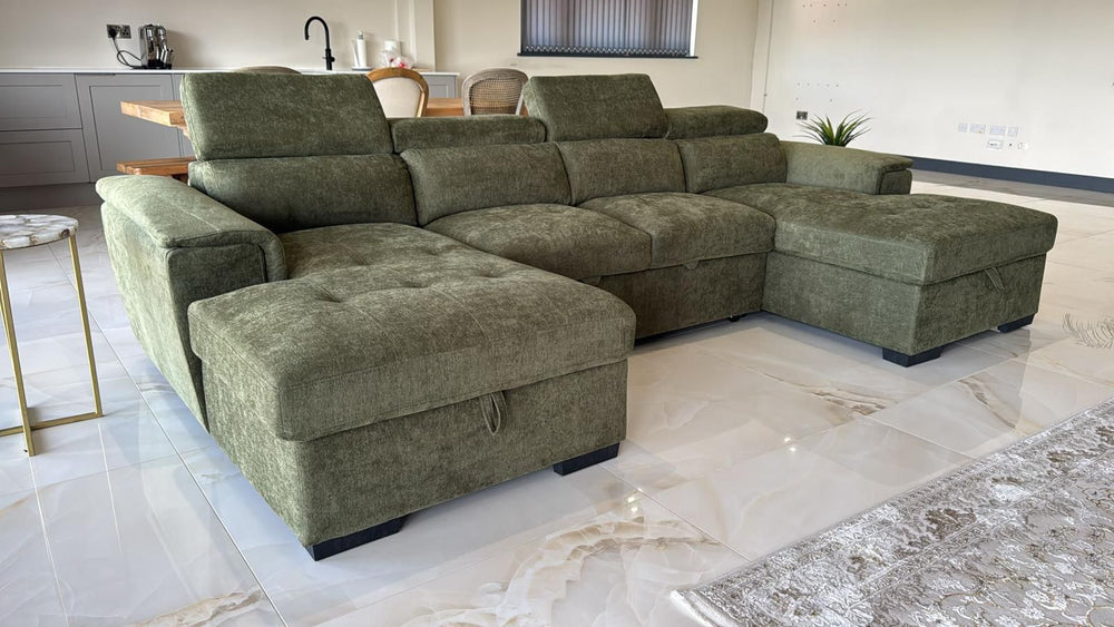 Green U-shaped sofa bed with extended chaise sections and cushioned backrests