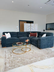 Chicago corner sofa in dark gray fabric, shown in a living room with a chaise-style end