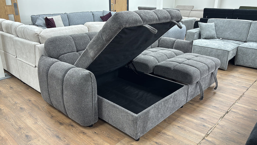 Gray sectional sofa bed with the chaise storage compartment open