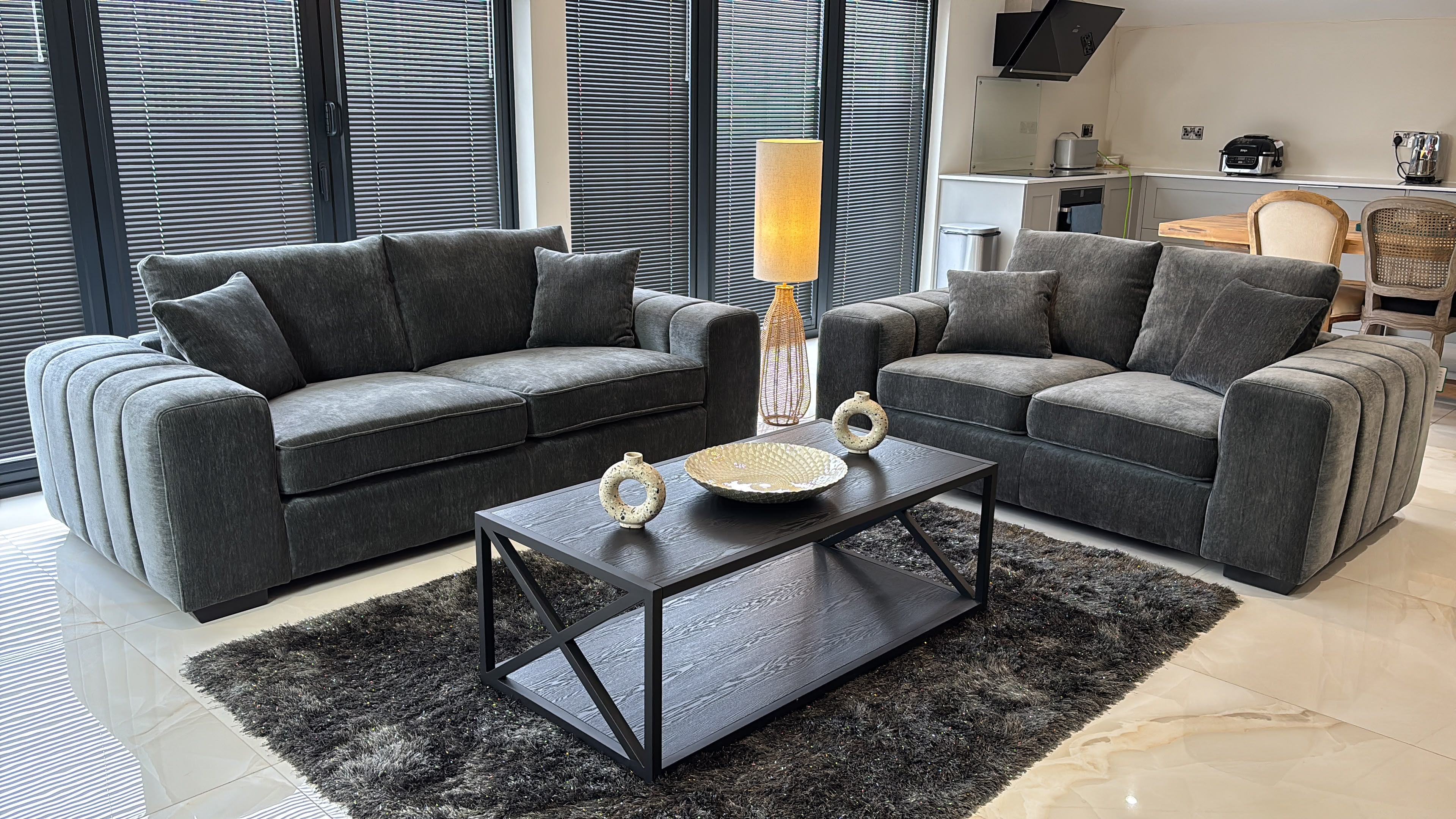 Gray fullback sofa set with two sofas, plush cushions and ribbed arms