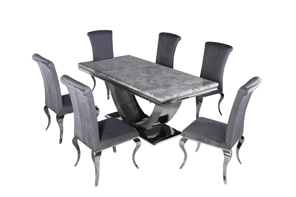 Arial dining table with gray stone top and sculptural pedestal, surrounded by six upholstered chairs