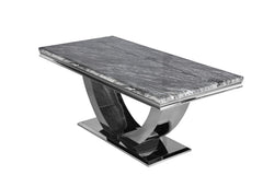 Arial dining table with a gray veined stone top and sculptural chrome pedestal base