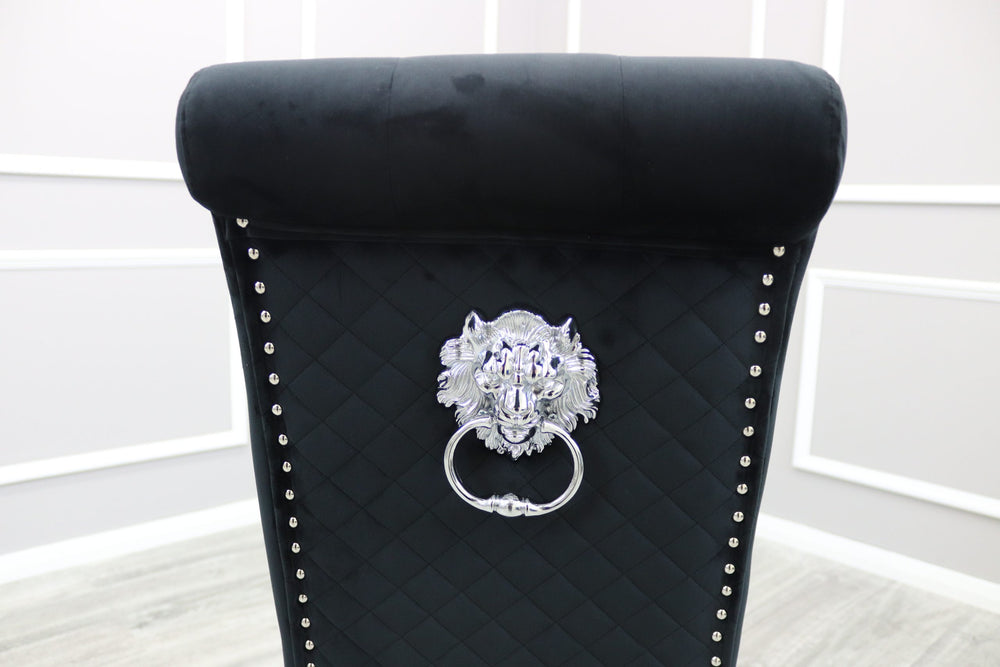 Black velvet dining chair back with diamond quilting, silver lion-head ring and stud trim