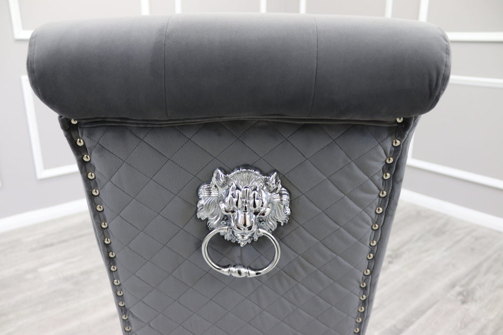 Dining chair back in dark grey velvet with diamond quilting, nailhead trim and lion-head ring pull