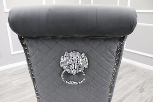 Dining chair back in dark grey velvet with diamond quilting, nailhead trim and lion-head ring pull