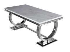 Arriana dining table with light gray veined top and sculptural polished metal base