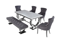 Arriana dining table with light gray top, shown with matching chairs and bench
