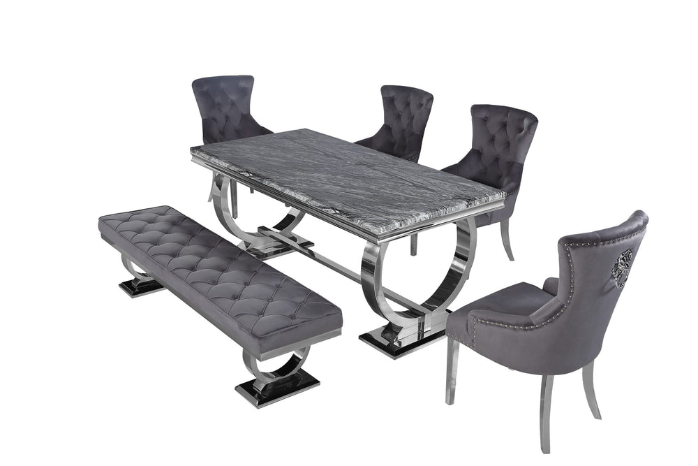 Arriana dining table with dark gray veined top, shown with matching chairs and bench