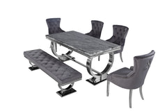 Arriana dining table with dark gray veined top, shown with matching chairs and bench