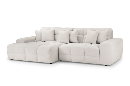 Large light beige corner sofa with plush seats and loose back cushions