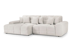 Large light beige corner sofa with plush seats and loose back cushions