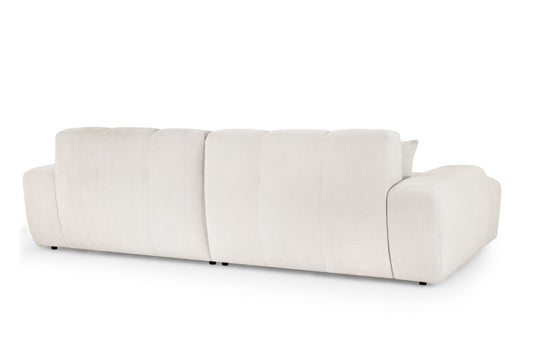 Large corner sofa shown from the back, with upholstered panels and low feet