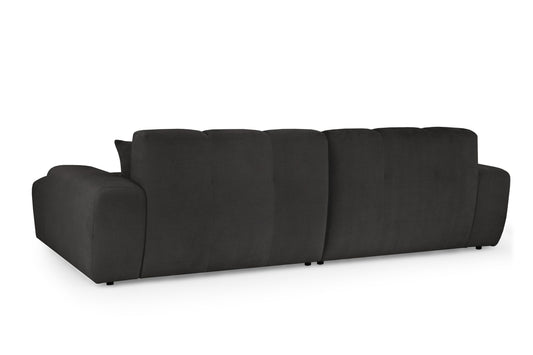 Rear view of large dark gray corner sofa with segmented back and low feet