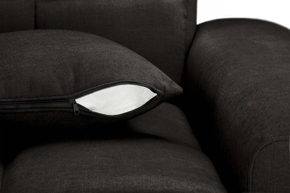 Sofa cushion with a zippered cover opened to reveal white filling