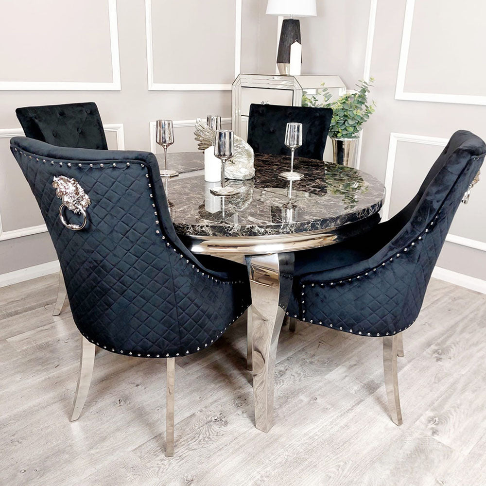 Black velvet dining chairs with diamond-quilted backs, chrome legs and decorative ring pulls