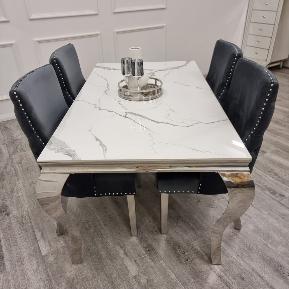 Louis Chrome dining table with a white marble-look top and curved chrome legs