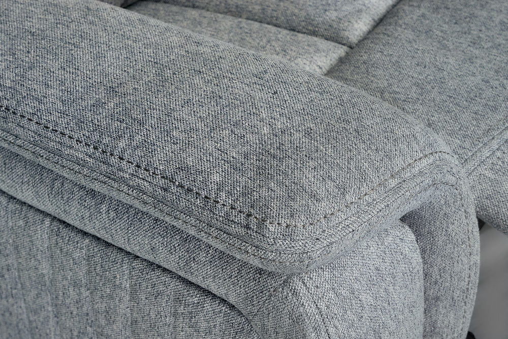 Close-up of the Linden recliner's padded gray arm and stitched upholstery